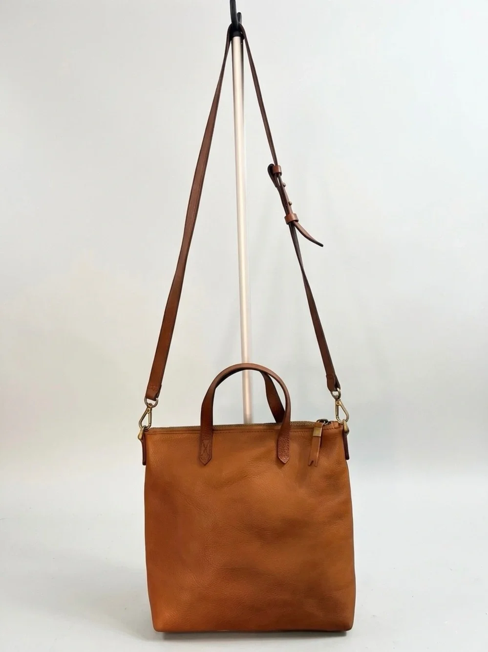 Madewell The Zip-Top Transport Crossbody Bag in English Saddle Leather.